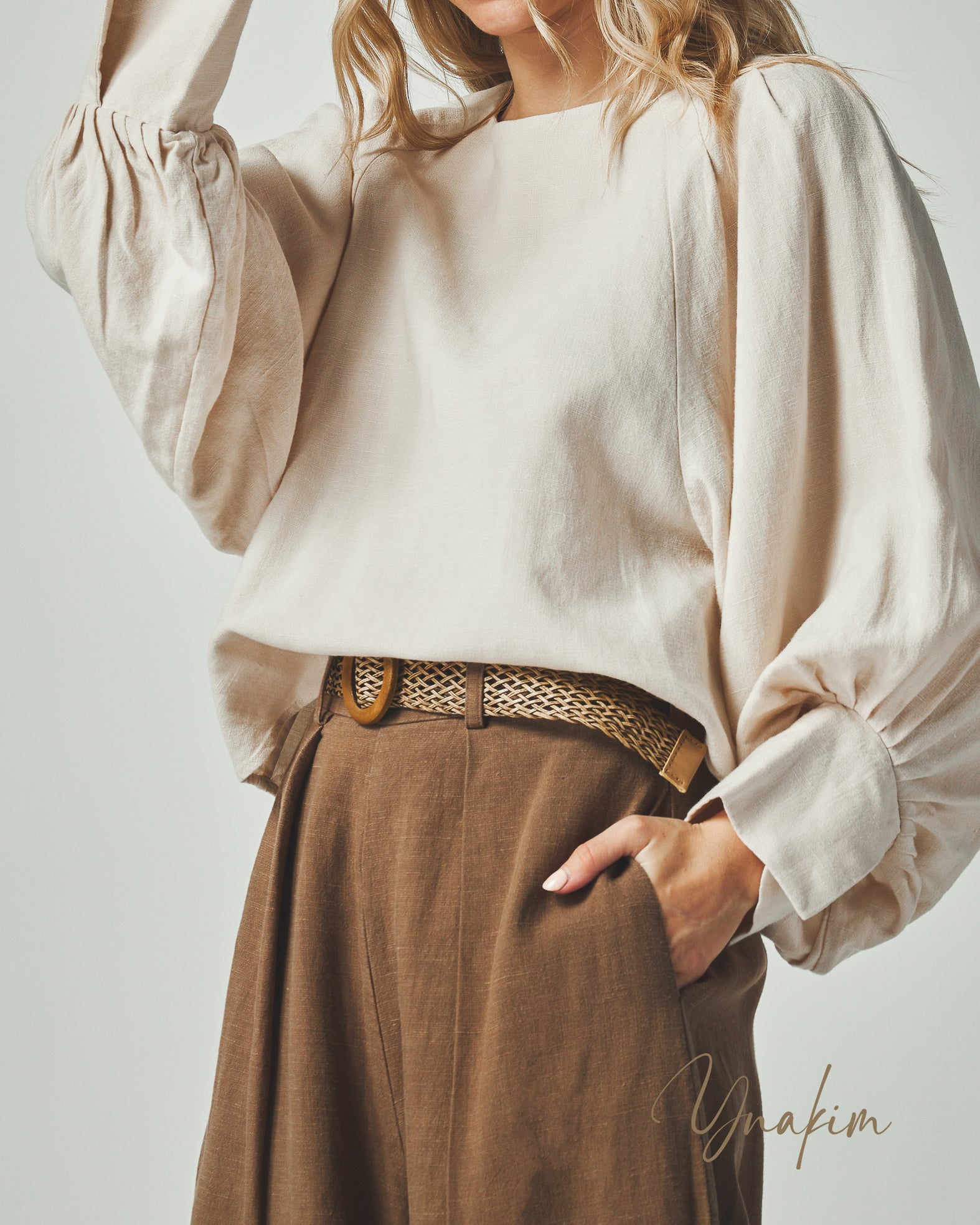 Boat neck line
Collarless
Dollman puff sleeves
Pleated cuffs
Loose fit blouse