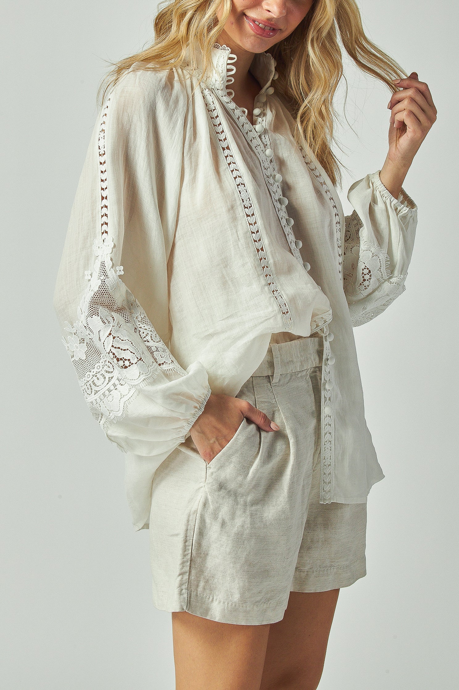 Feminine blouse with band collar and lace trim
