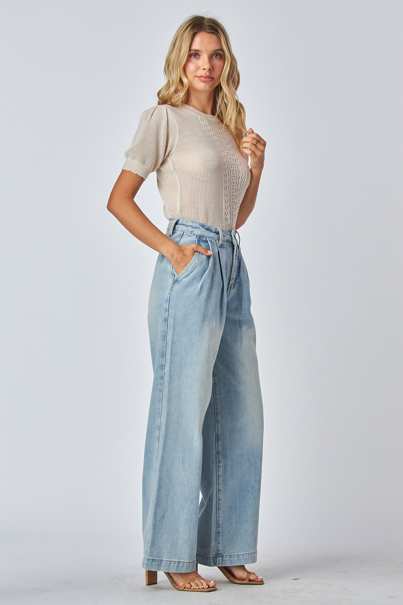 Girl wearing a high waist straight leg jeans

