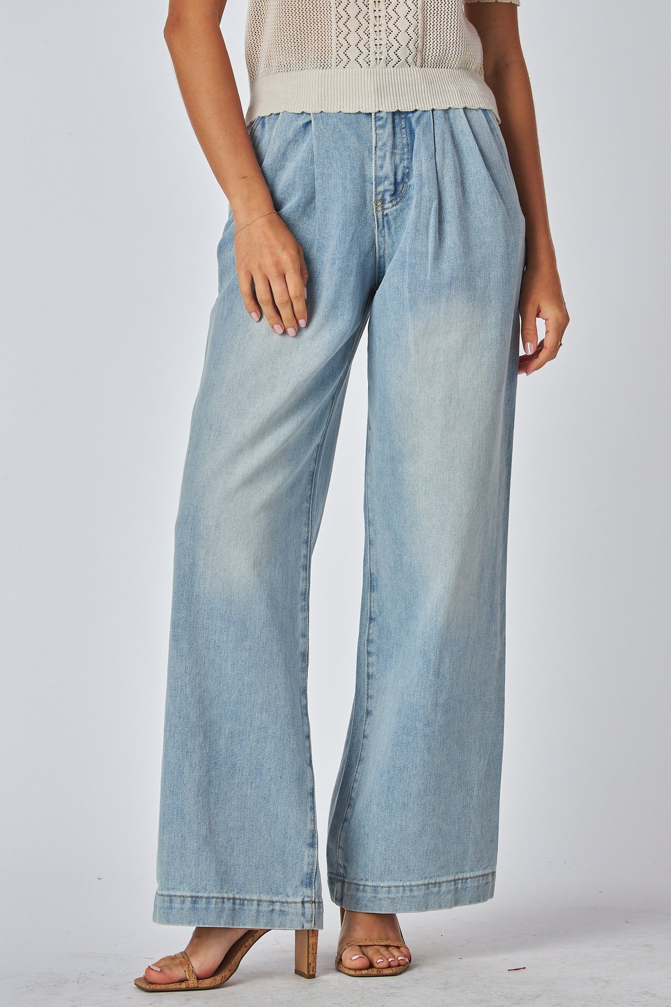 Female Wearing a Straight leg pleated jeans