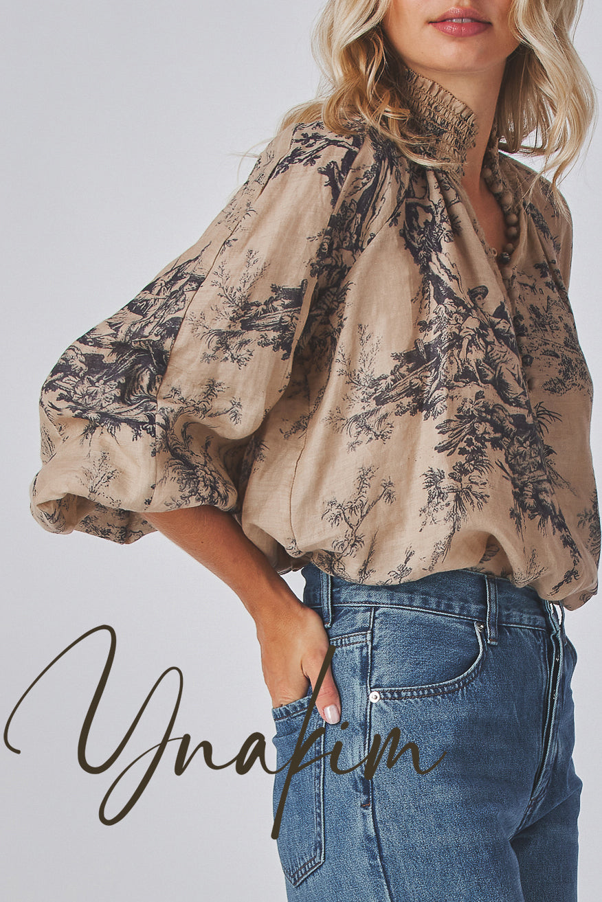 Model wearing a beige floral blouse and blue jeans with 'Ynakim' branding.