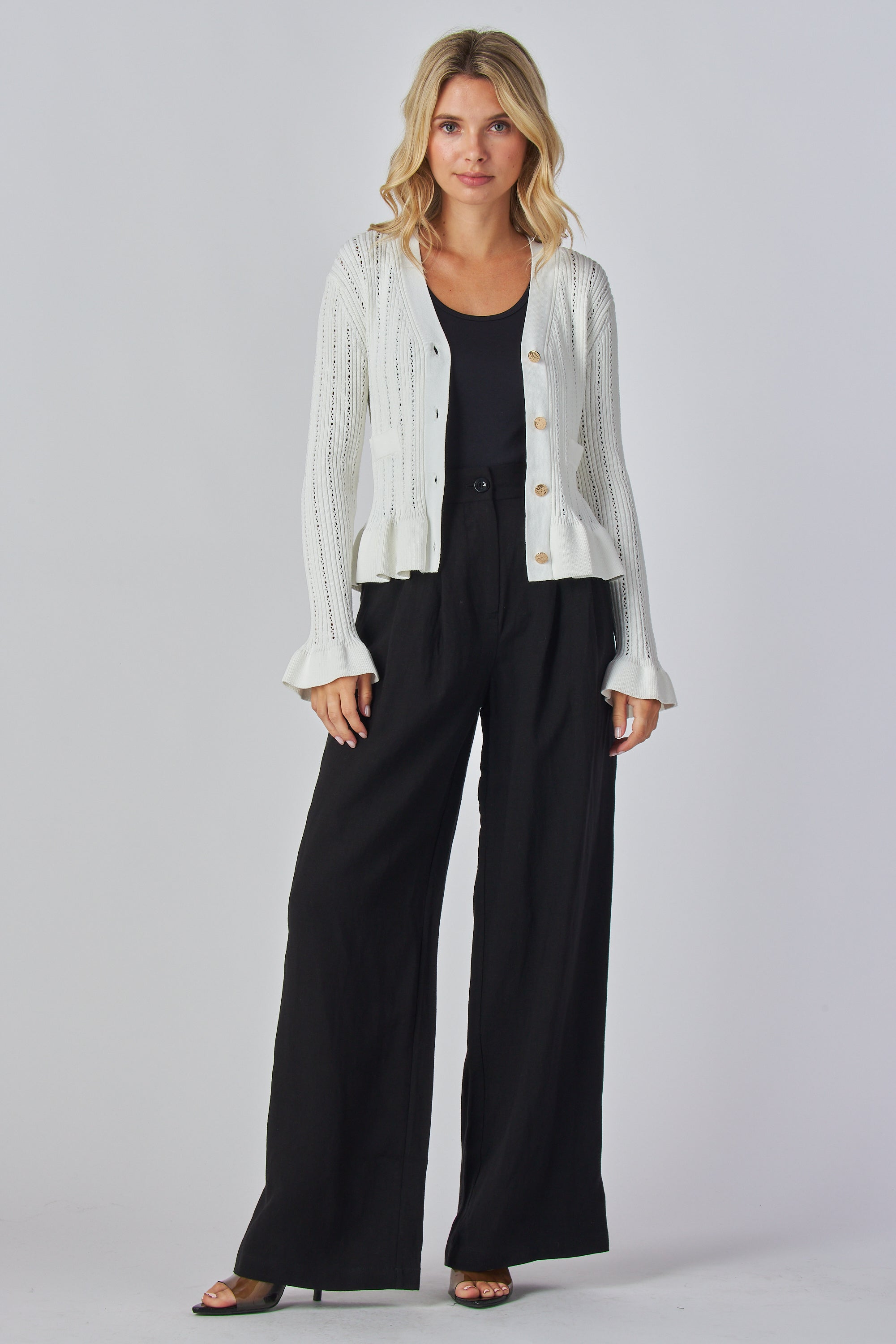 Long sleeve knit blouse
V-neck ruffle blouse
Ruffle hem knit top
Button front knit blouse
Knit ruffle cuff top