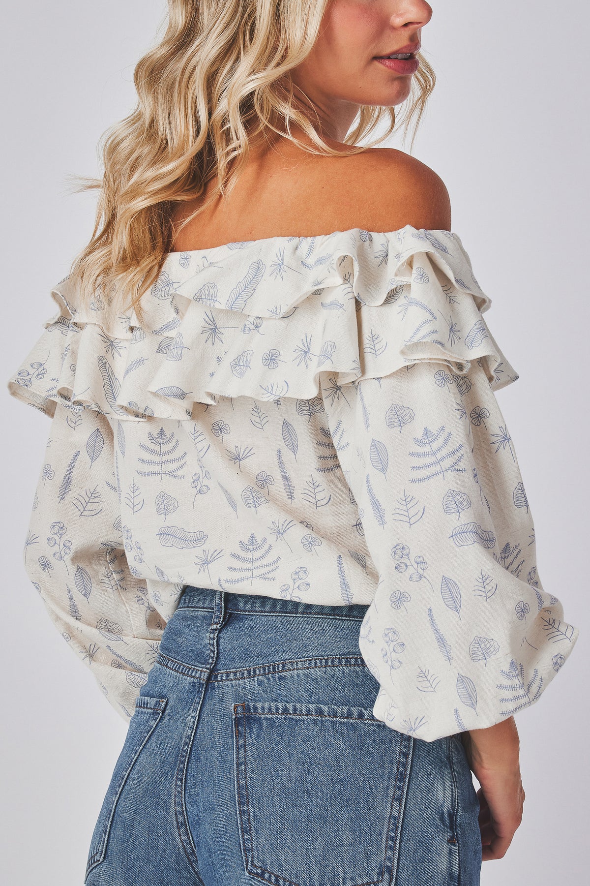 Grazia Top cream botanical print top side view with the lantern sleeve