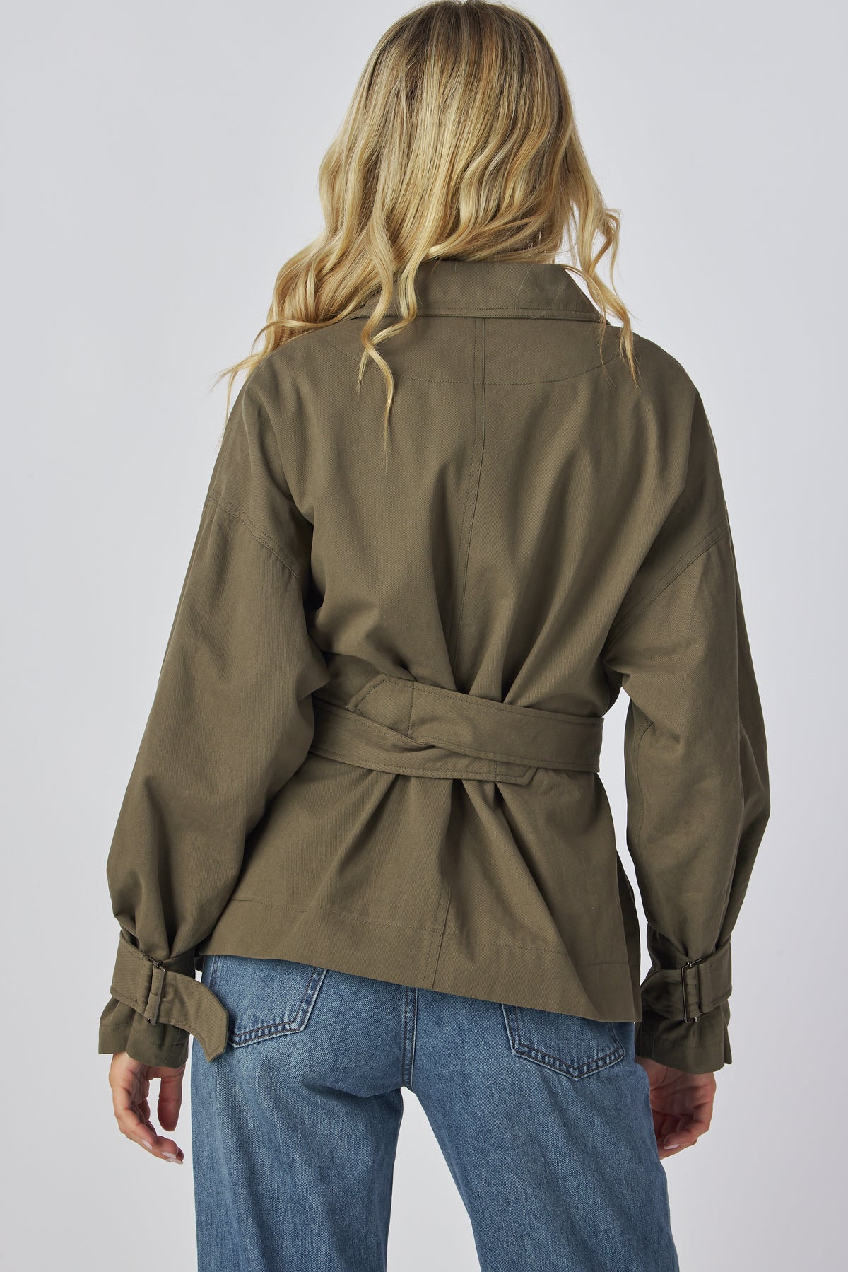 Linden Jacket in olive showing the relaxed back and tied belt, back view