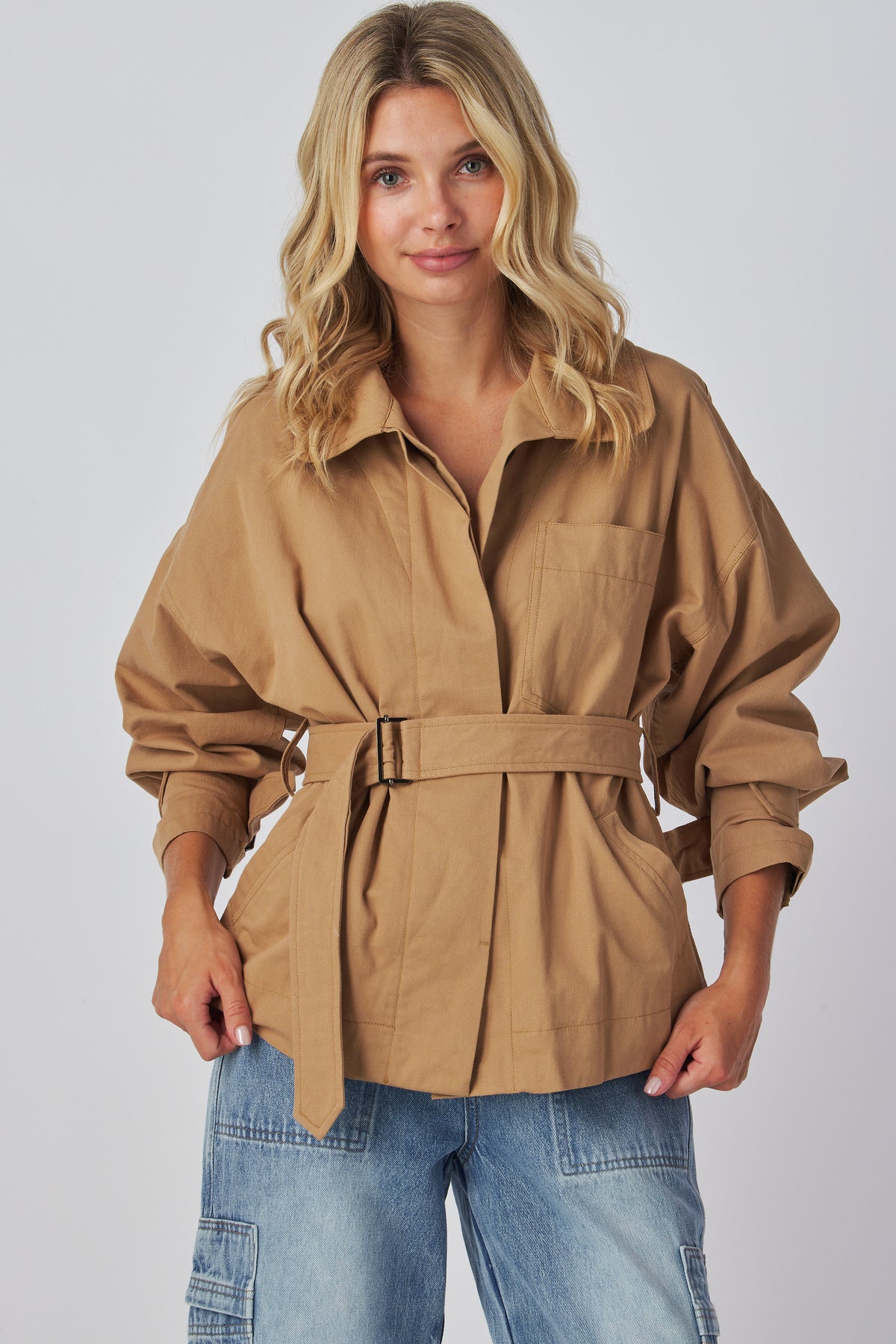 Linden Jacket in taupe worn with denim, full length front view