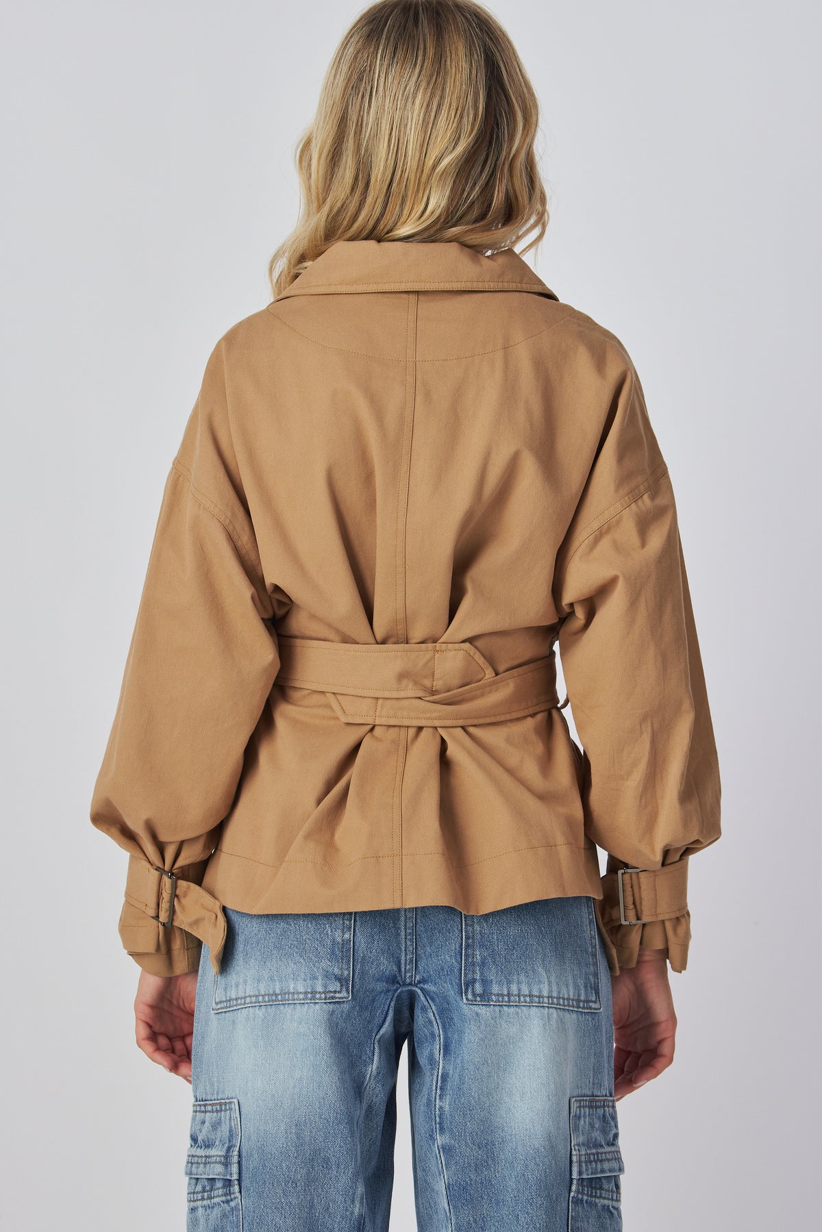 Linden Jacket in taupe showing the plain back and belt, back view