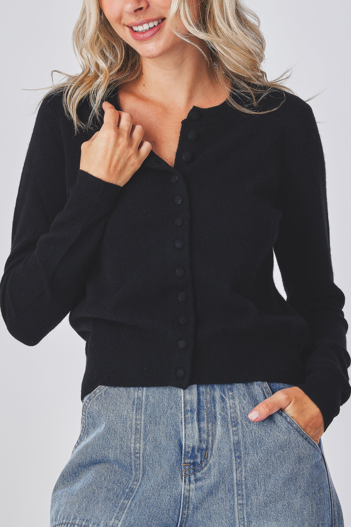 Mabel Cardigan in black, close view of the button front and neckline