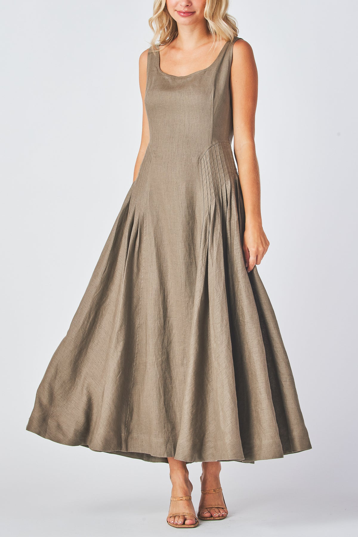 Miranda Dress in mocha linen showing the deep pleats of the skirt, front view
