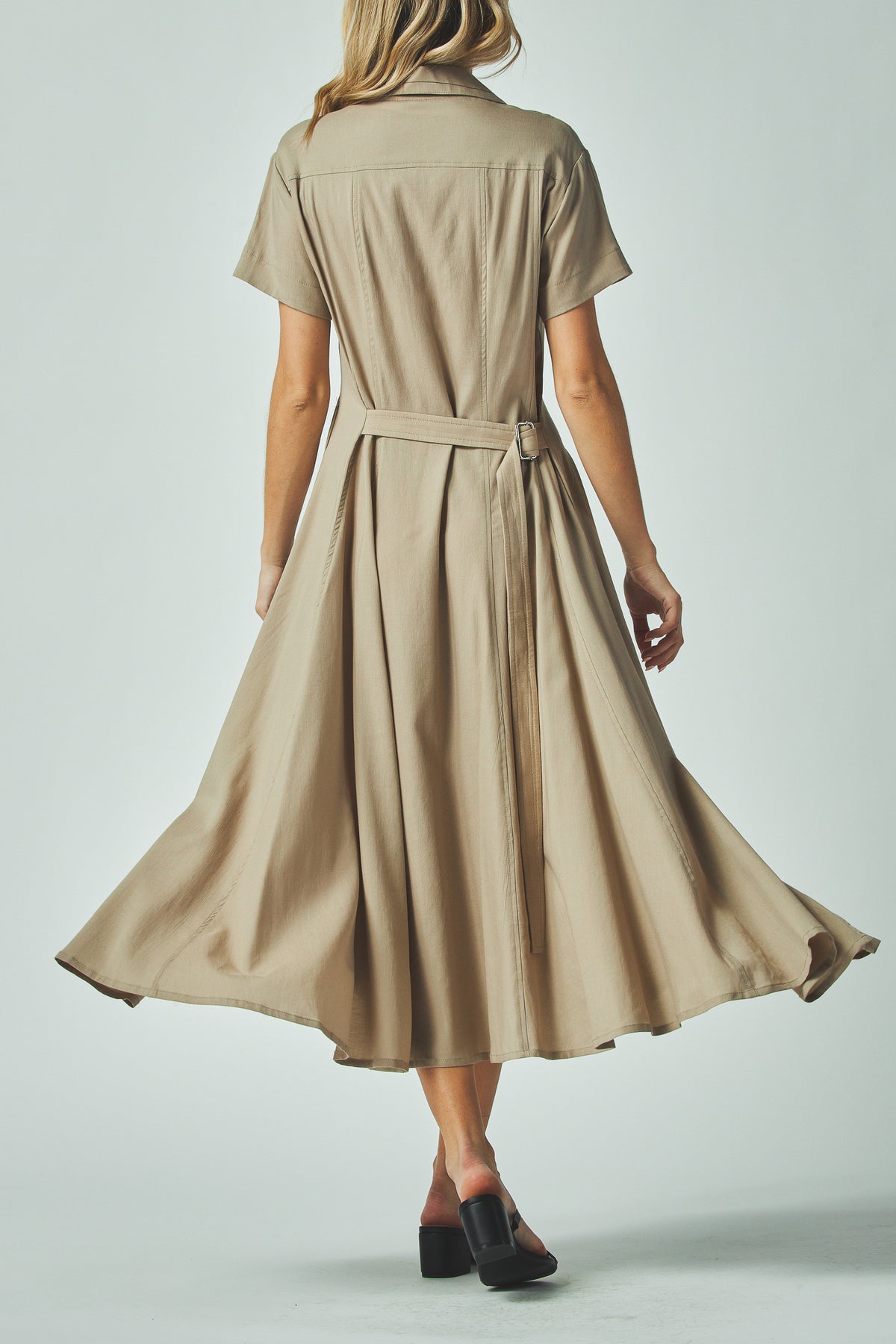 Nora Dress in taupe, back view of the belt tied at the waist