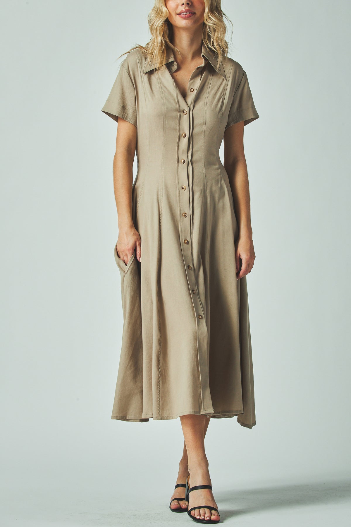 Nora Dress in taupe with a fitted waist and midi skirt, front view